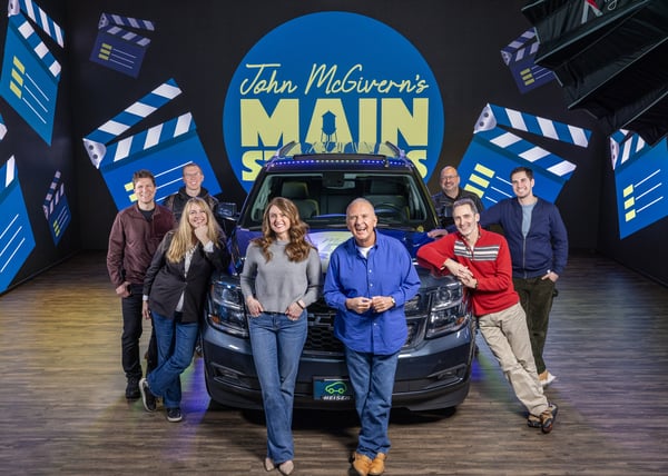 The John McGyver Main Street crew in front of the LED screen